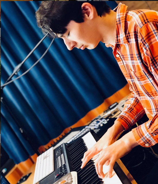 Justin Stone playing the piano